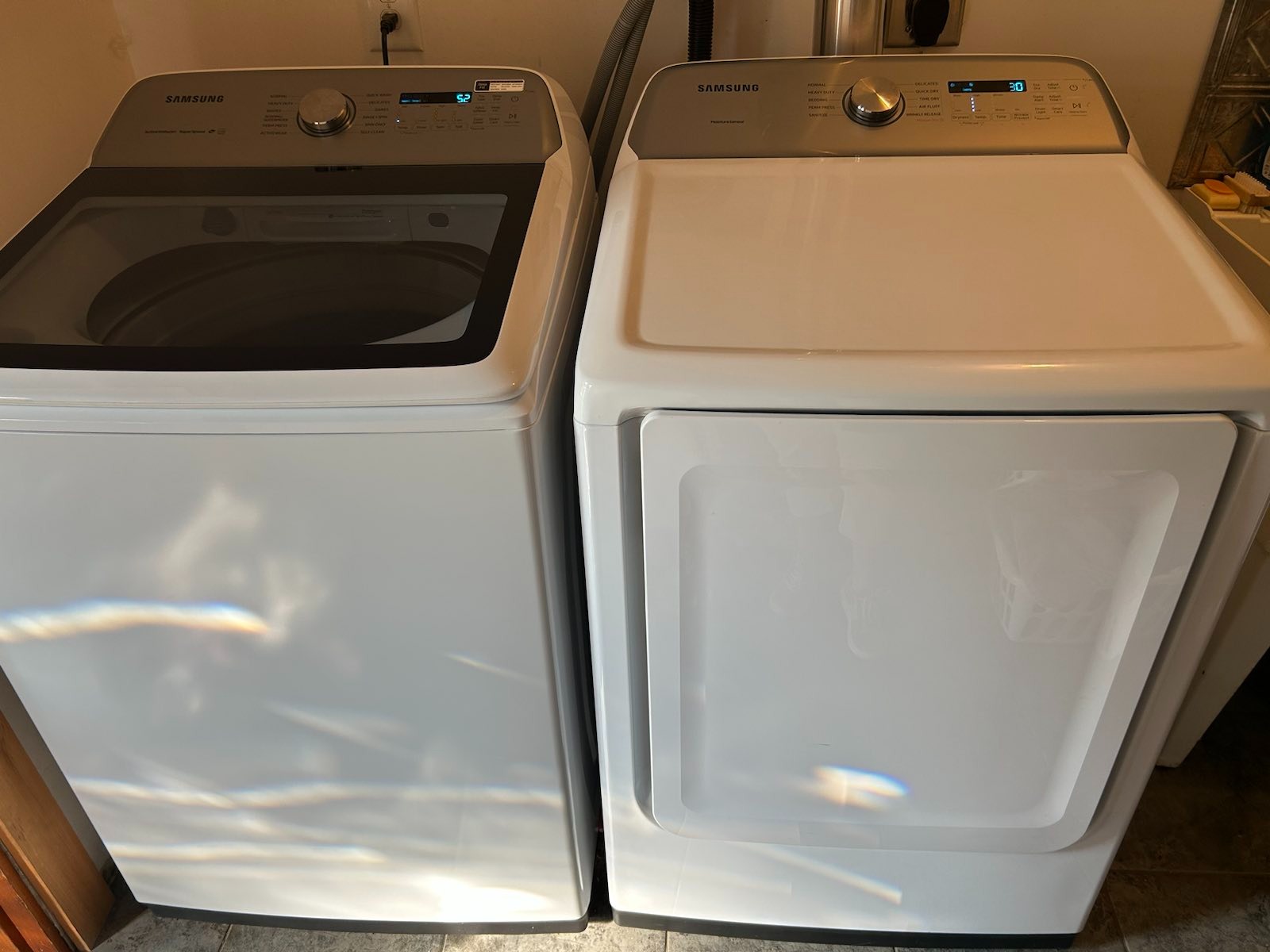 New (2022), full-sized, top-loading washer, and dryer.