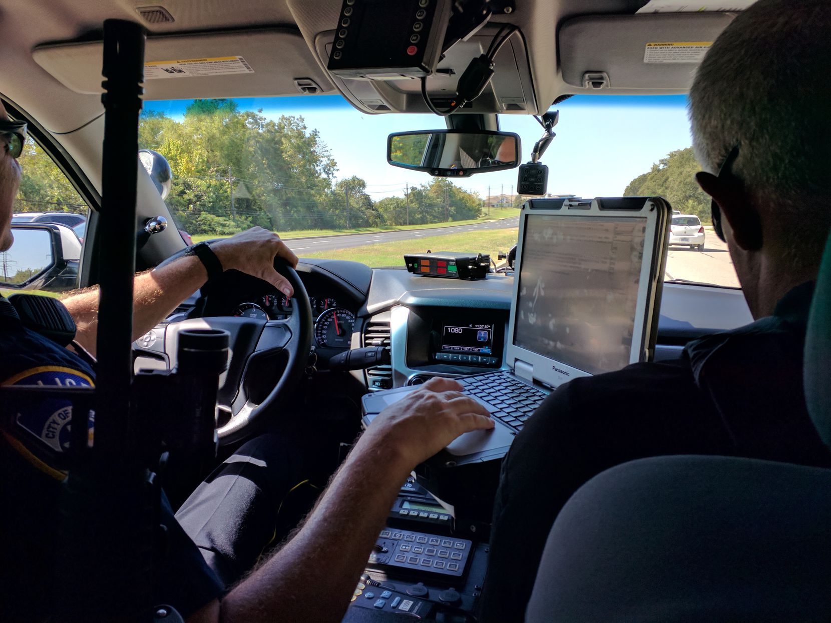 Mental Health Peace Officer Casey Sanders (left) and Mental Health Coordinator Ken Bennett patrol a neighborhood in Euless